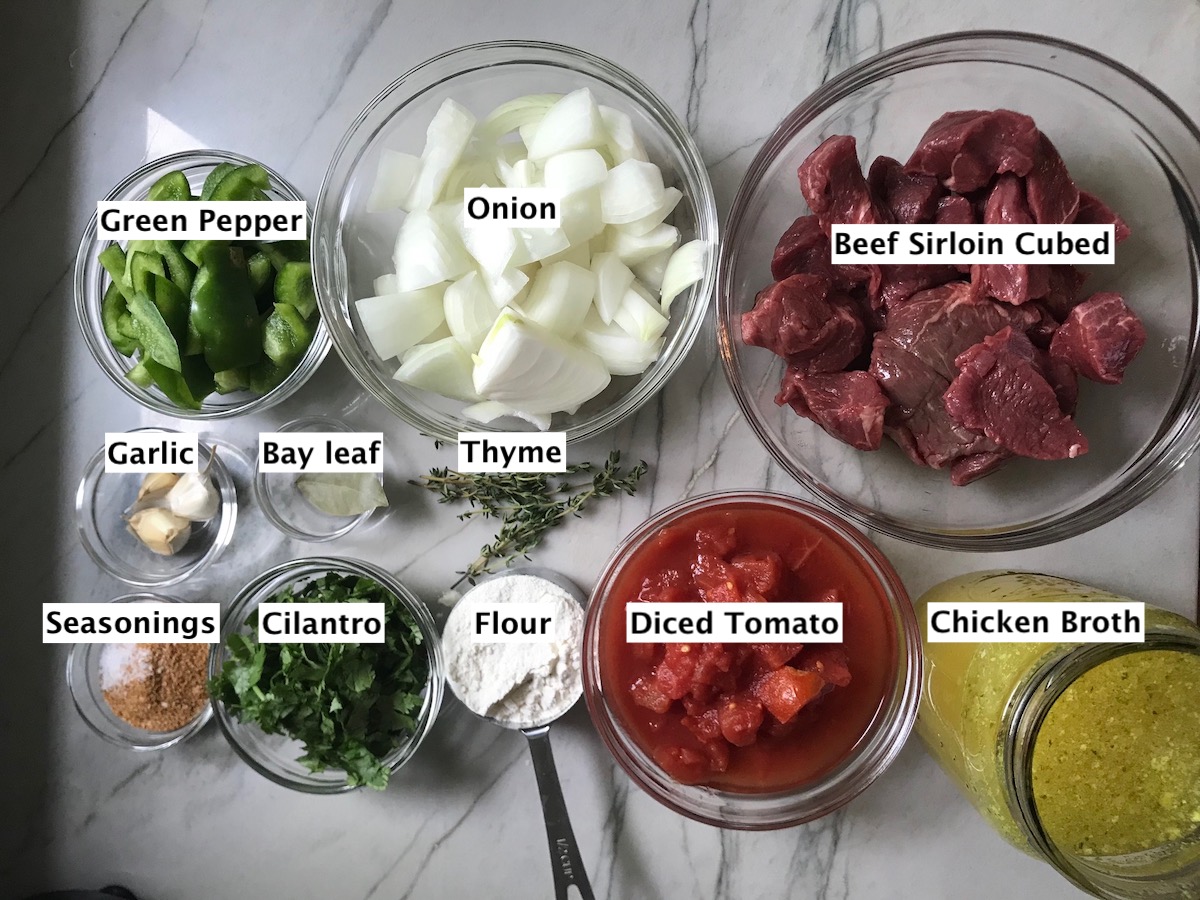 All ingredients prepped and measured in bowls with labels for Brazilian Beef Stew Stove Top recipe.