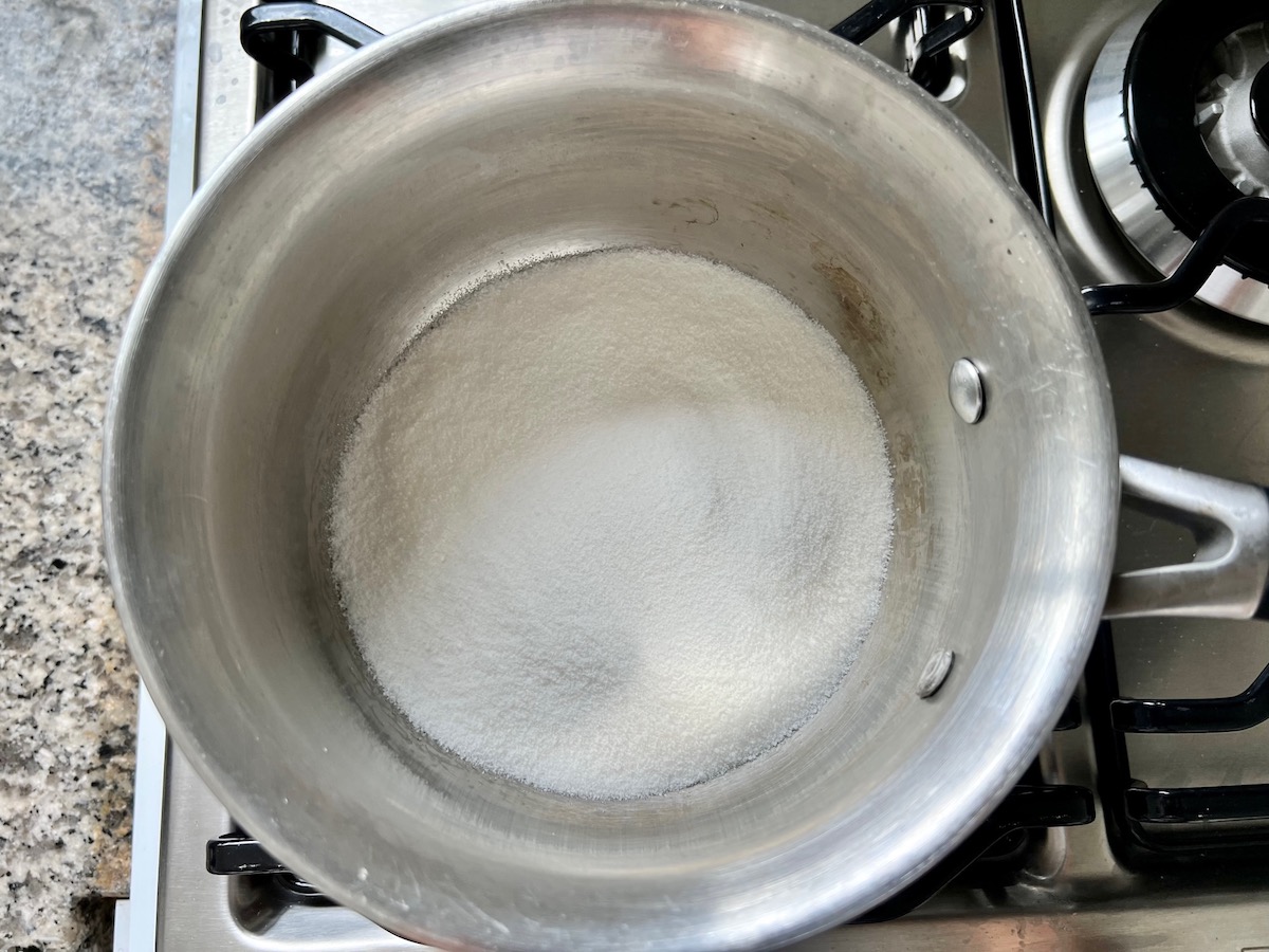 Granulated sugar in a pot for Brazilian Flan Recipe, or Pudim.