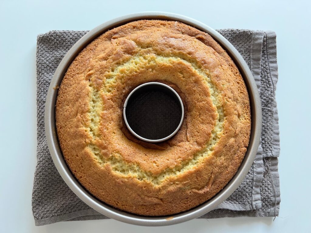 Fully baked, golden brown Cake with Lime in a bundt pan..