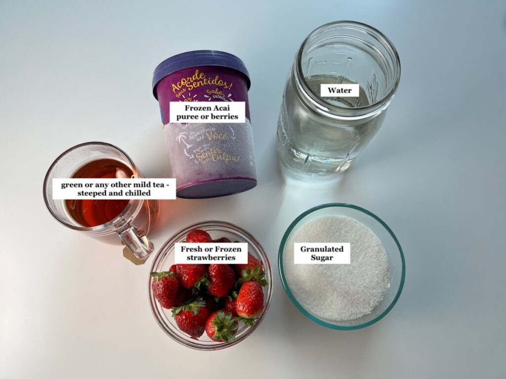 Ingredients prepped, measured out in bowls, and labeled  for the recipe: How to make Strawberry Acai Refresher..