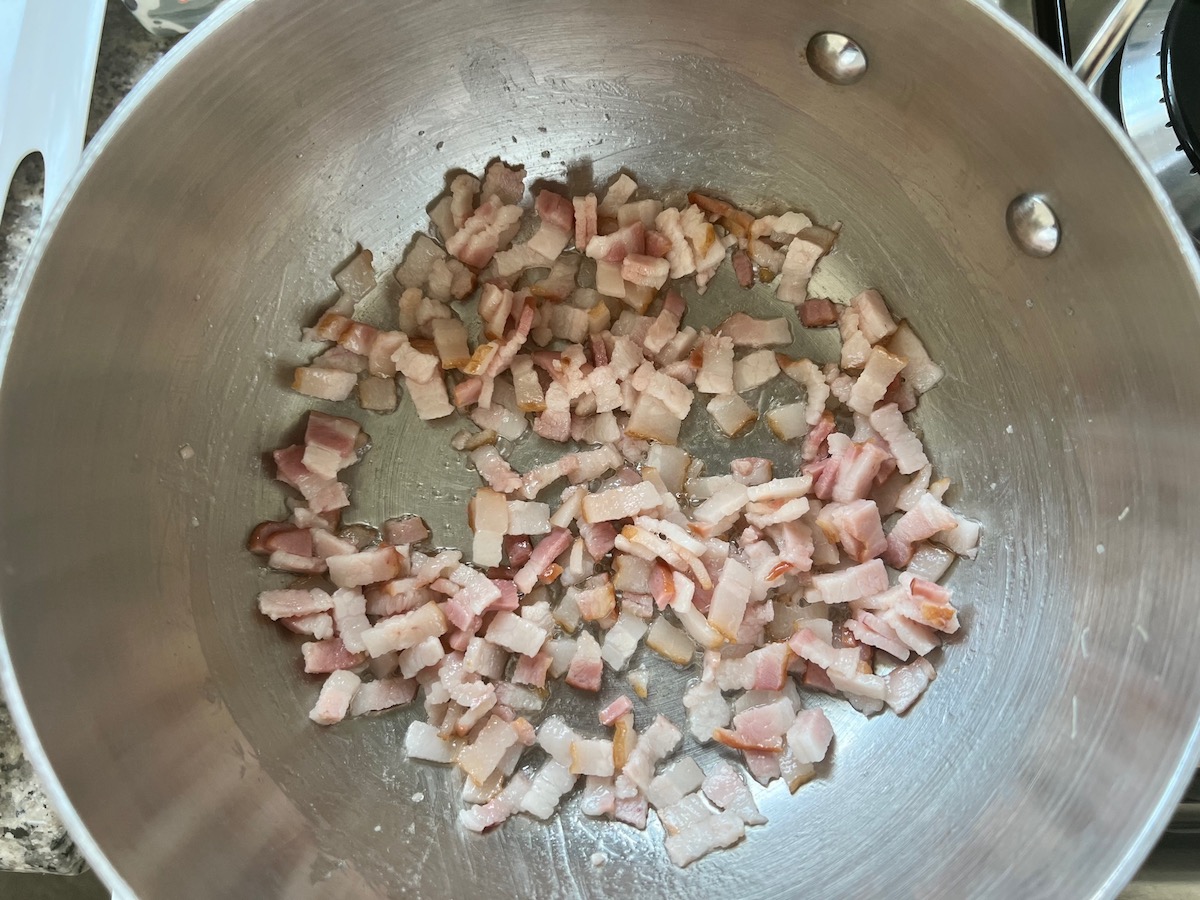 Diced raw bacon in pot for Arroz Pilaf.